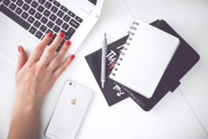 woman-hand-smartphone-desk (1)